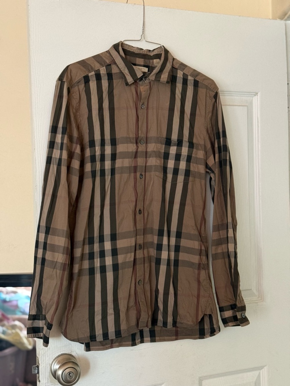 Burberry men long sleeve button up 
Size medium
Had a little bleach spot